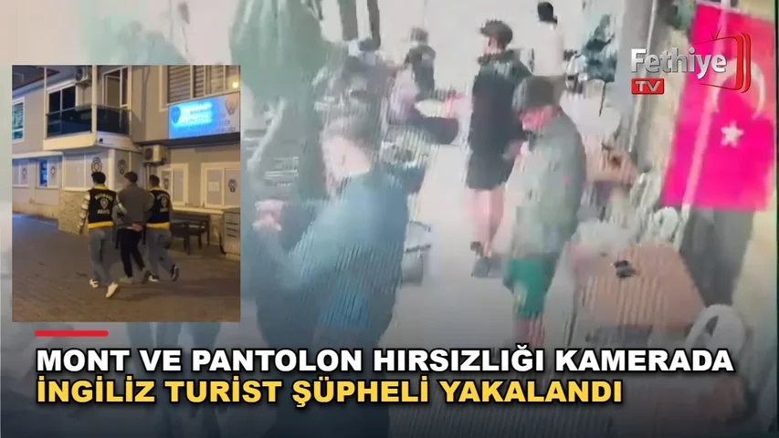 Marmaris'te bir iş yerinden mont ve pantolon alan turistin yakalanma anı