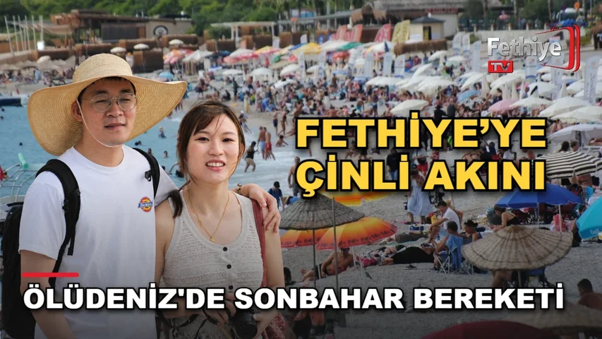 Fethiye Ölüdeniz'de sonbaharda güneşli havayı değerlendiren Çinli turistler sahilde ve Babadağ'da paraşütle vakit geçiriyor