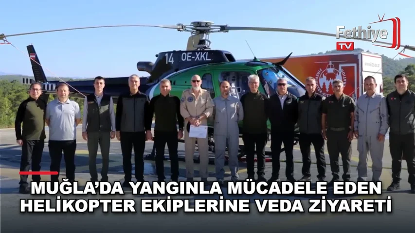 Muğla Orman Bölge Müdürü Mustafa Ülküdür, yangınla mücadelede görev alan helikopter personeline teşekkür belgesi verdi.