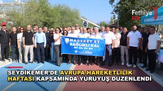Seydikemer Yürüyş Yolu'nda Avrupa Hareketlilik Haftası kapsamında düzenlenen farkındalık yürüyüşüne katılan vatandaşlar ve protokol üyeleri.