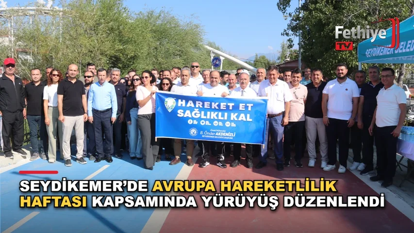 Seydikemer Yürüyş Yolu'nda Avrupa Hareketlilik Haftası kapsamında düzenlenen farkındalık yürüyüşüne katılan vatandaşlar ve protokol üyeleri.