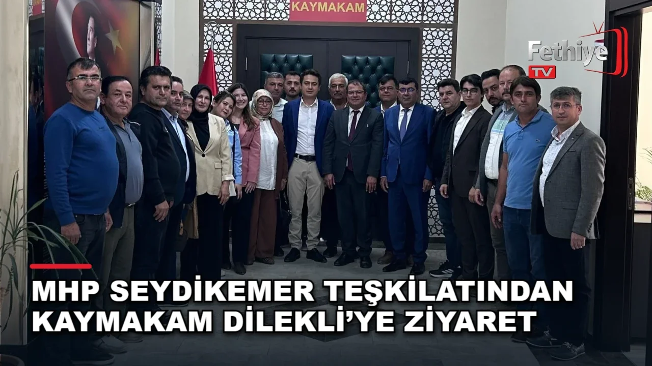 MHP Seydikemer İlçe Başkanı Mehmet Arıç ve heyeti, Kaymakam Mustafa Dilekli'yi makamında ziyaret etti.