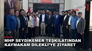 MHP Seydikemer İlçe Başkanı Mehmet Arıç ve heyeti, Kaymakam Mustafa Dilekli'yi makamında ziyaret etti.