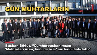 Fethiye'de 19 Ekim Muhtarlar Günü töreninde konuşan Muhtarlar Derneği Başkanı Cafer Söğüt ve katılımcılar.