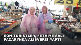 Fethiye Salı Pazarı'nda yağmur nedeniyle alışverişe yönelen turistler ve pazarcı esnafı