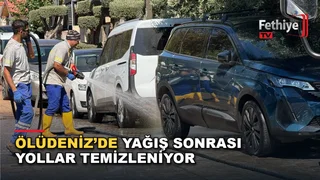 Fethiye Ölüdeniz'de yağış sonrası yollarda biriken çamurun belediye ekiplerince temizlenmesi